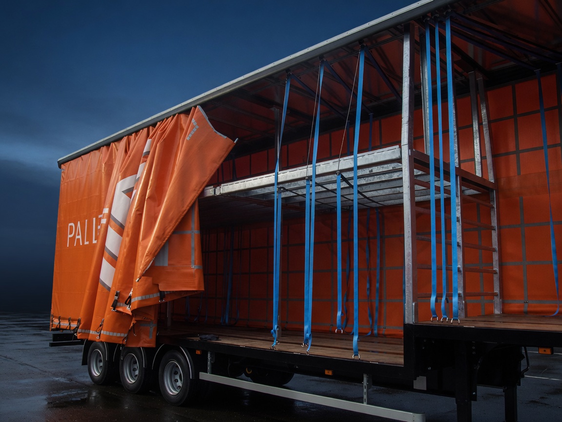 Empty curtainsider showing Slide & Carry straps hanging from the roof track